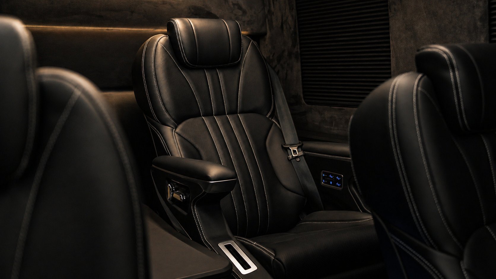 Luxury black leather car seats with contrast stitching and headrests in modern vehicle interior